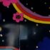 Consumerism - Photograph of mural on shopping mall wall with the text Born to Shop and fraphics of stars, flowers and circles in flouro bright colours on a black background