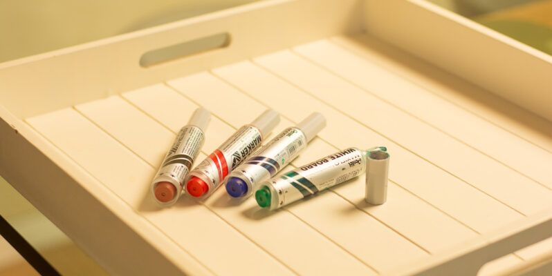 Coloured markers on a tray to illustrate GoodSense marketing strategy